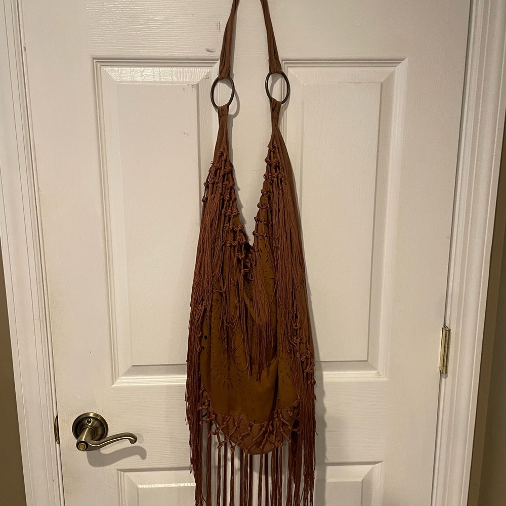 Hobo style fringe suede shoulder bag..